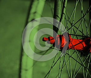 Red metallic parts of a spoke wheel of a bicycle