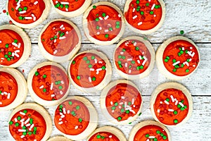 Red mini frosted iced buttercream sugar cookies Christmas holiday background
