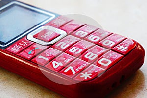 A red mobile phone with keyboard