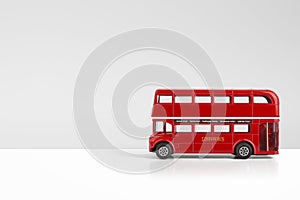 Red Model Bus London concept on a grey background