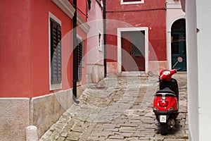 Red moped on Piran street - Slovenia