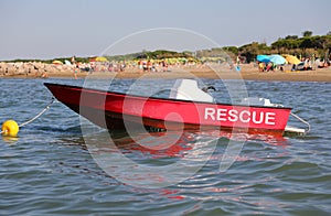 red motorboat with the word RESCUE for the rescue of bathers