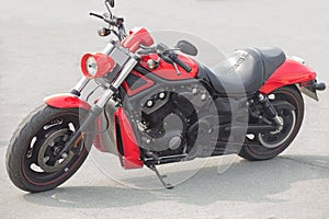 Red motorcycle on asphalt