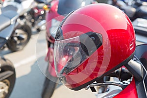 Red motorcycle helmet on a motorcycle