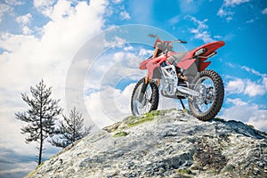 Red motorcycle on top of mountain landscape. 3d