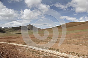 Red mountains and green plateau meadows