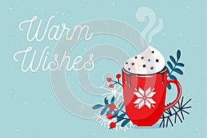 Red mug with christmas hot chocolate or coffee with whipped cream surrounding with branches, floral elements. Warm