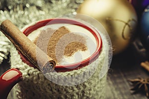 Red mug eggnog and christmas decoration/red mug eggnog and christmas decoration. Selective focus