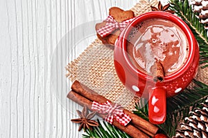 Red mug with hot chocolate and gingerbread cookies