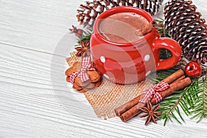 Red mug with hot chocolate and gingerbread cookies