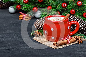 Red mug with hot white chocolate and gingerbread cookies