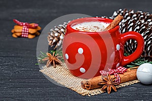 Red mug with hot white chocolate and gingerbread cookies