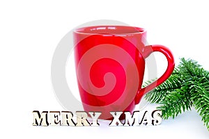 Red mug, inscription merry christmas and branches of christmas tree isolated on white background. Christmas and New Year.