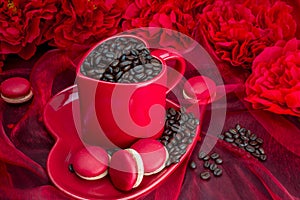 Red mug with macaroon rosted coffee beans sexy red background photo