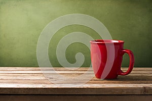 Red mug on wooden table
