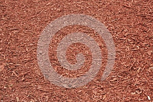 Red mulch covered ground for planting