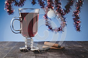 Red Mulled wine, spices and Christmas decorations/red Mulled wine, spices and Christmas decorations on blue background