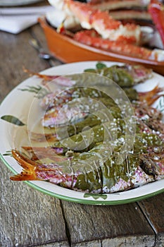 Red mullet wrapped in vine leaves with coarse salt