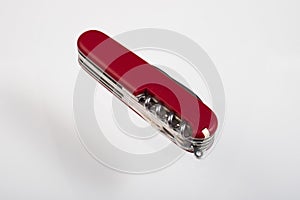 Red multitool closed knife isolated