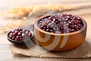 Red mung bean or Azuki bean in wooden bowl with spoon