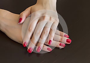 Red nail polish.