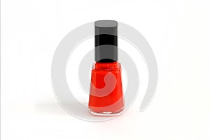 Red nail polish in a bottle