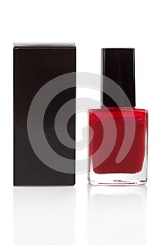 Red nail polish bottle and black box