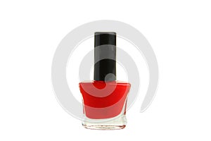 Red nail polish bottle isolated on white.