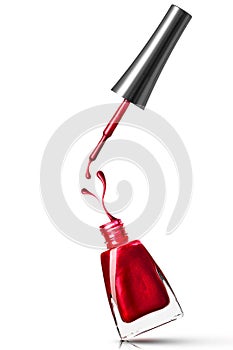 Red nail polish bottle with splash photo