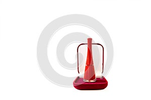 Red nail polish bottle on white background