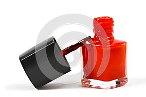 Red nail Polish and brush isolated on white background