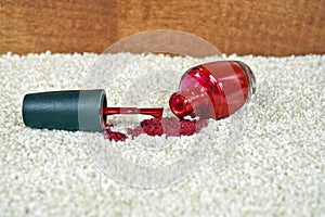 Red nail polish spill on carpet