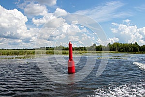 Red navigation marker on a river