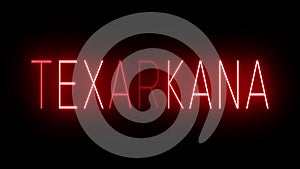 Red neon sign for the city of Texarkana