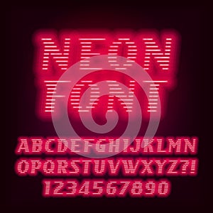 Red neon tube alphabet font. Neon color oblique letters and numbers. Stock vector typeset.