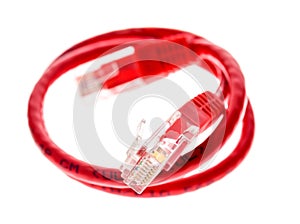 Red network UTP cable with RJ45 connector isolated on white.