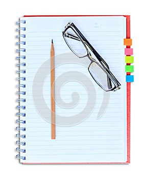 Red notebook pencil and eyeglasses isolated on white background