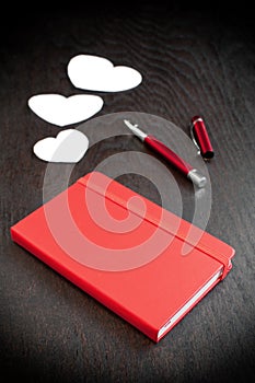 Red notebook with romantic diary
