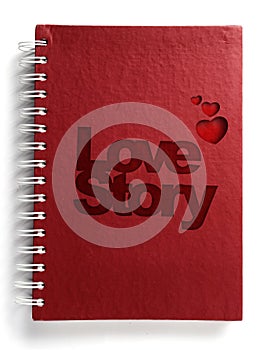 Red notebook with text love story