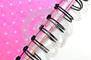 Red notebook with wire binding.