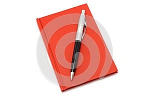 Red notepad with ball pen