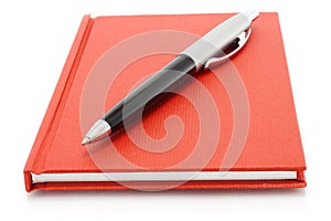 Red notepad with ball pen