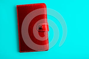 red notepad on a blue background