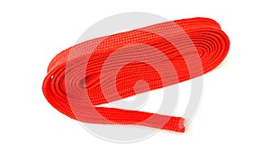 Red nylon rope on white background. Fabric rope in red color folded in a coil