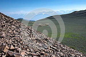 Red oceanic rock overlooks the White Mountains in California, by the Ancient Bristlecone Pine Forest