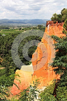 Red ocher cliffs in the village of Roussillon in Provence