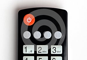 Off button on the TV remote control. Television remote control closeup