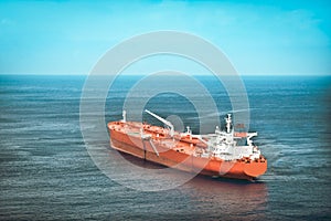 Red oil tanker or cargo ship on the sea
