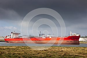 Red oil tanker moored an oil terminal in the Port of Rotterdam