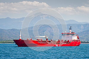 The red oil tanker transports petroleum products photo
